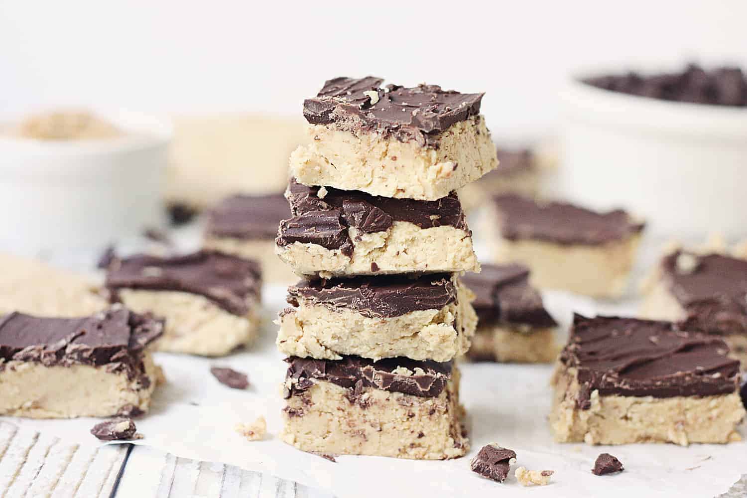 Quick & Easy No-Bake Peanut Butter Bars - Quick and easy no-bake peanut butter bars are always a hit! They require only five ingredients and a few minutes to prep... and even less time to devour! #peanutbutter #easy #easyrecipe #chocolate #reeses #nobake #nobakerecipe #dessert #nobakedessert #baking #halfscratched #freezerrecipe