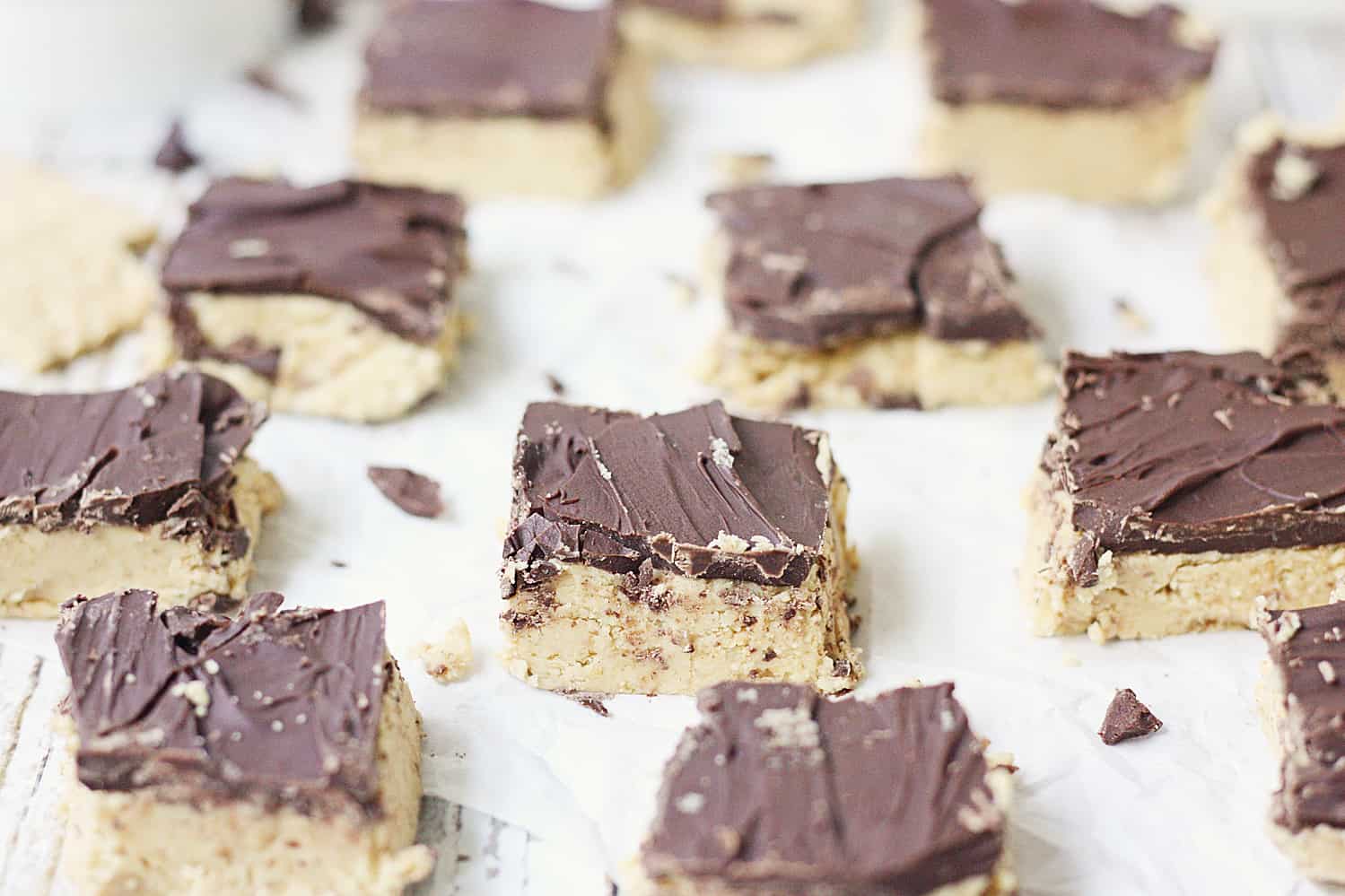 Quick & Easy No-Bake Peanut Butter Bars - Quick and easy no-bake peanut butter bars are always a hit! They require only five ingredients and a few minutes to prep... and even less time to devour! #peanutbutter #easy #easyrecipe #chocolate #reeses #nobake #nobakerecipe #dessert #nobakedessert #baking #halfscratched #freezerrecipe