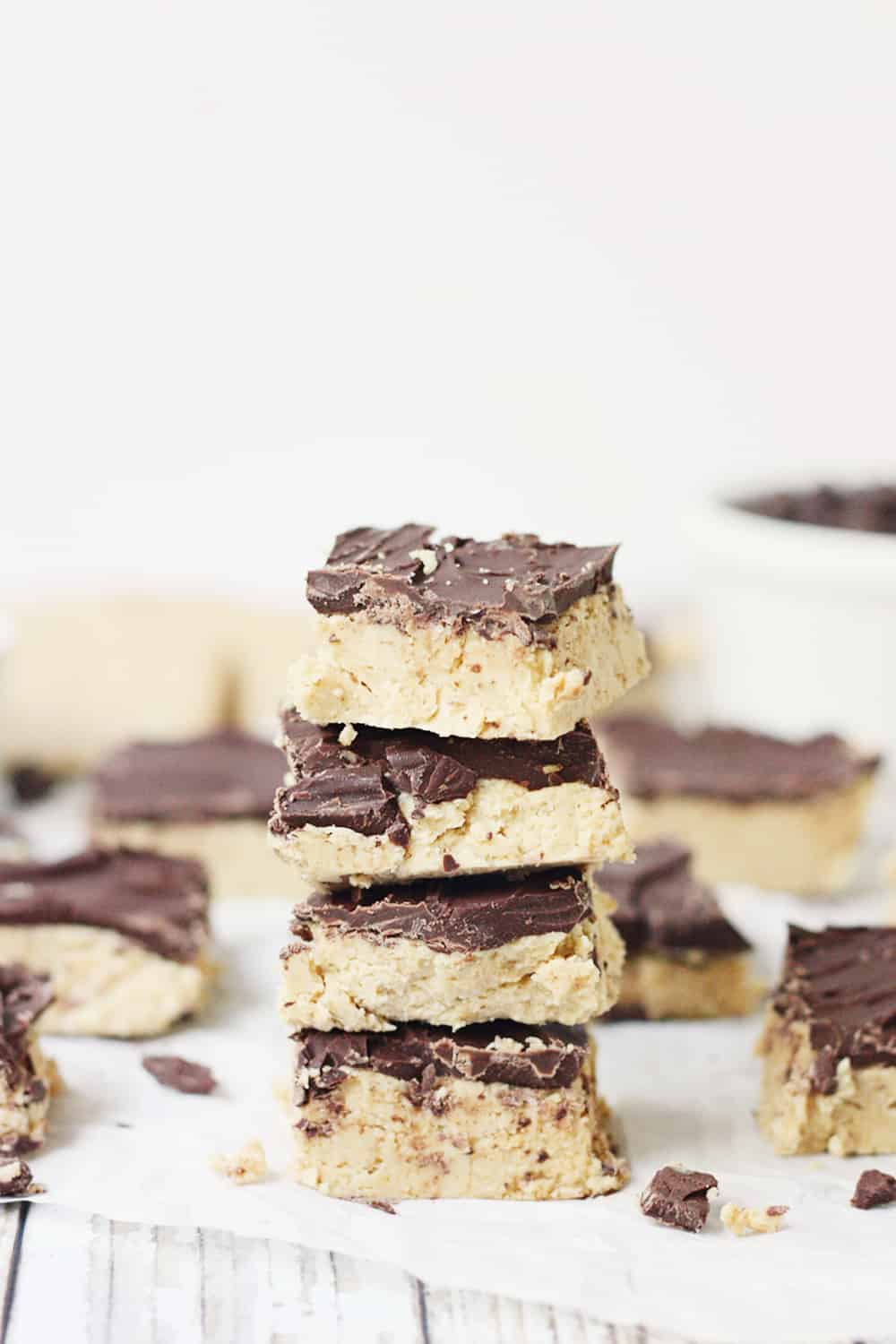 Quick & Easy No-Bake Peanut Butter Bars - Quick and easy no-bake peanut butter bars are always a hit! They require only five ingredients and a few minutes to prep... and even less time to devour! #peanutbutter #easy #easyrecipe #chocolate #reeses #nobake #nobakerecipe #dessert #nobakedessert #baking #halfscratched #freezerrecipe