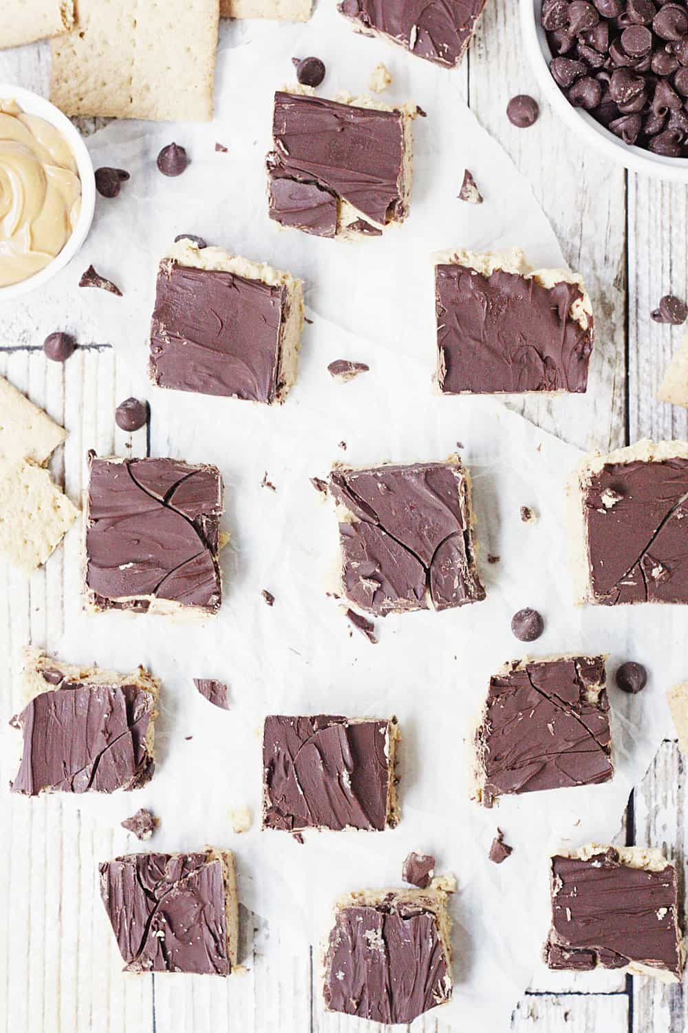 Quick & Easy No-Bake Peanut Butter Bars - Quick and easy no-bake peanut butter bars are always a hit! They require only five ingredients and a few minutes to prep... and even less time to devour! #peanutbutter #easy #easyrecipe #chocolate #reeses #nobake #nobakerecipe #dessert #nobakedessert #baking #halfscratched #freezerrecipe