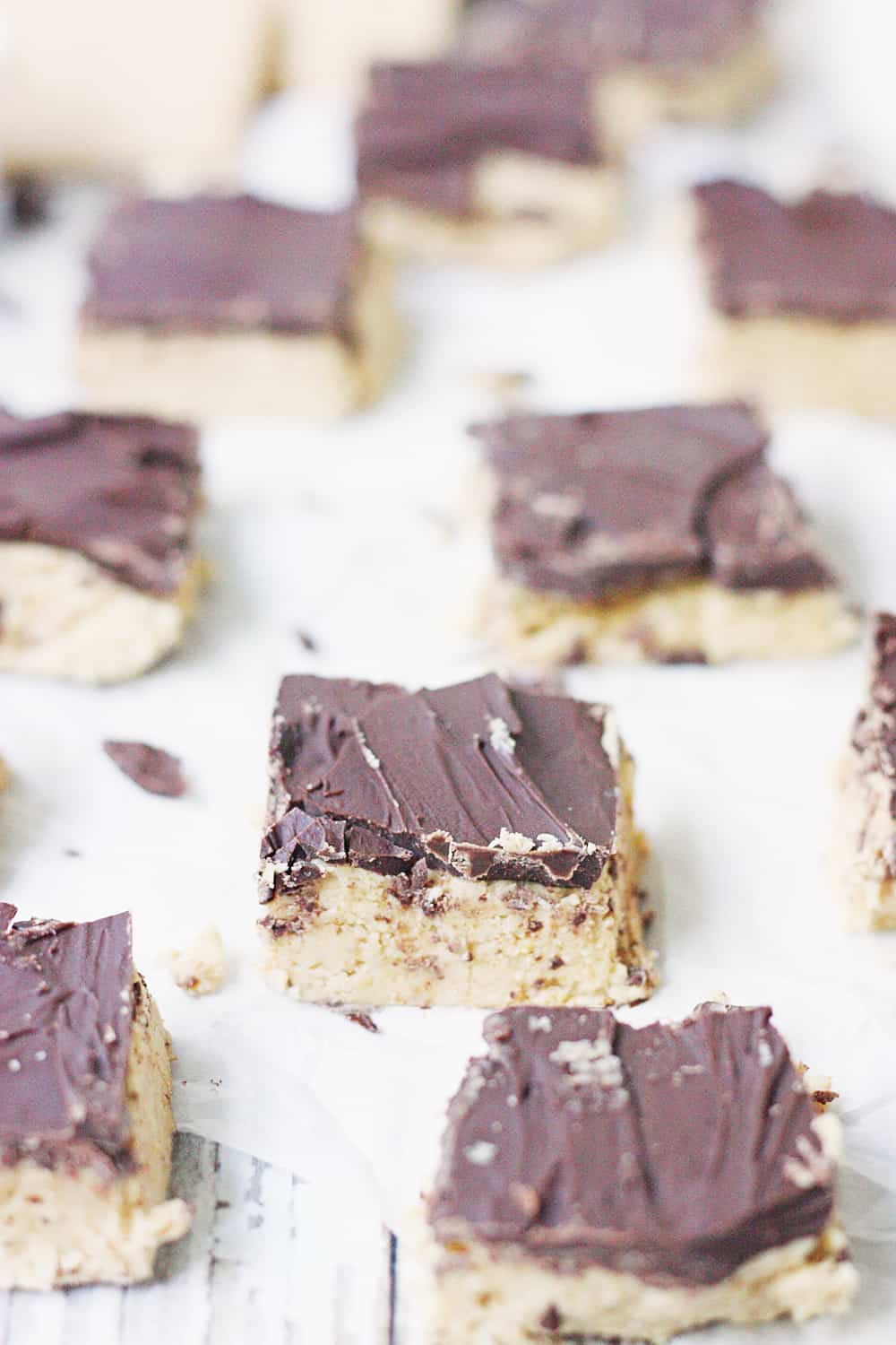 Quick & Easy No-Bake Peanut Butter Bars - Quick and easy no-bake peanut butter bars are always a hit! They require only five ingredients and a few minutes to prep... and even less time to devour! #peanutbutter #easy #easyrecipe #chocolate #reeses #nobake #nobakerecipe #dessert #nobakedessert #baking #halfscratched #freezerrecipe