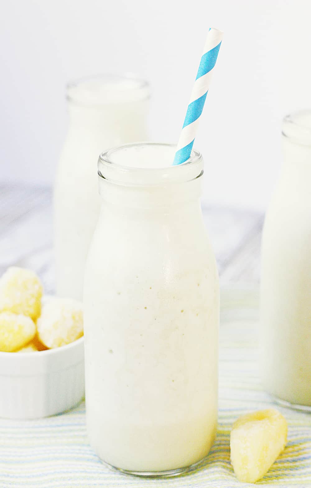 Pina Colada Protein Smoothie - This pina colada protein smoothie is an easy, healthy, delicious, protein-packed way to enjoy your favorite tropical beverage! #halfscratched #pinacolada #smoothie #proteinshake #proteinsmoothie #smoothierecipe #drinkrecipe #drink #healthyrecipe #healthy #pinacoladashake