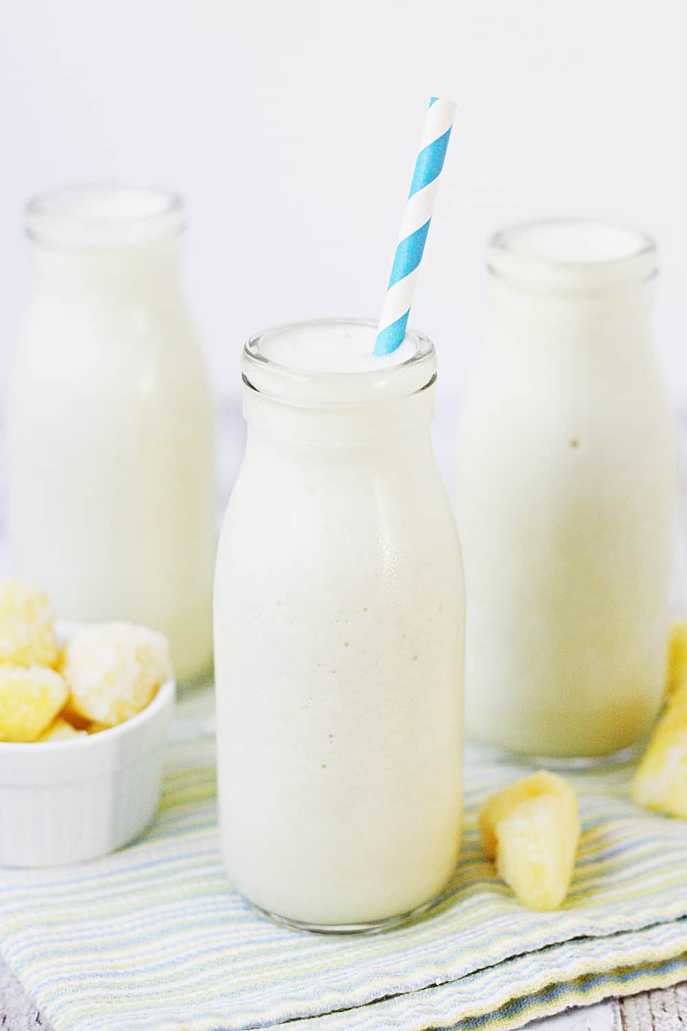 Pina Colada Protein Smoothie - This pina colada protein smoothie is an easy, healthy, delicious, protein-packed way to enjoy your favorite tropical beverage! #halfscratched #pinacolada #smoothie #proteinshake #proteinsmoothie #smoothierecipe #drinkrecipe #drink #healthyrecipe #healthy #pinacoladashake