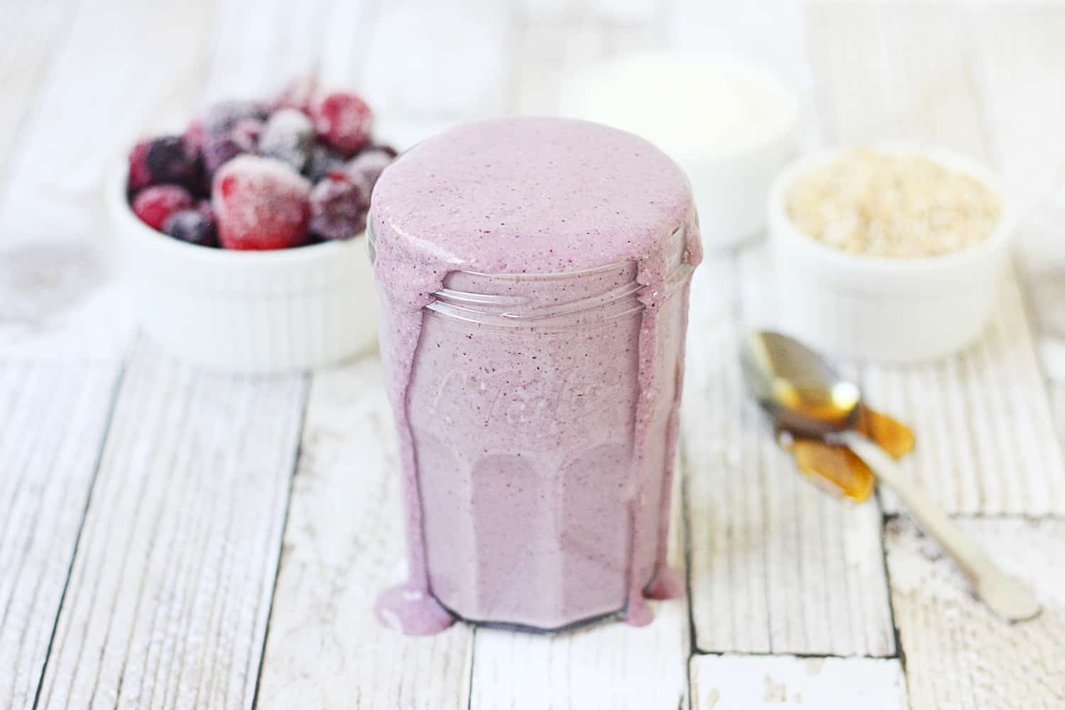 Mixed Berry Protein Smoothie - This mixed berry protein smoothie combines frozen berries, Greek yogurt, steel-cut oats, and protein powder for a healthy, delicious breakfast shake to start your day! #smoothie #proteinshake #proteinsmoothie #shake #breakfast #recipe #berry #halfscratched #ad #easyrecipe