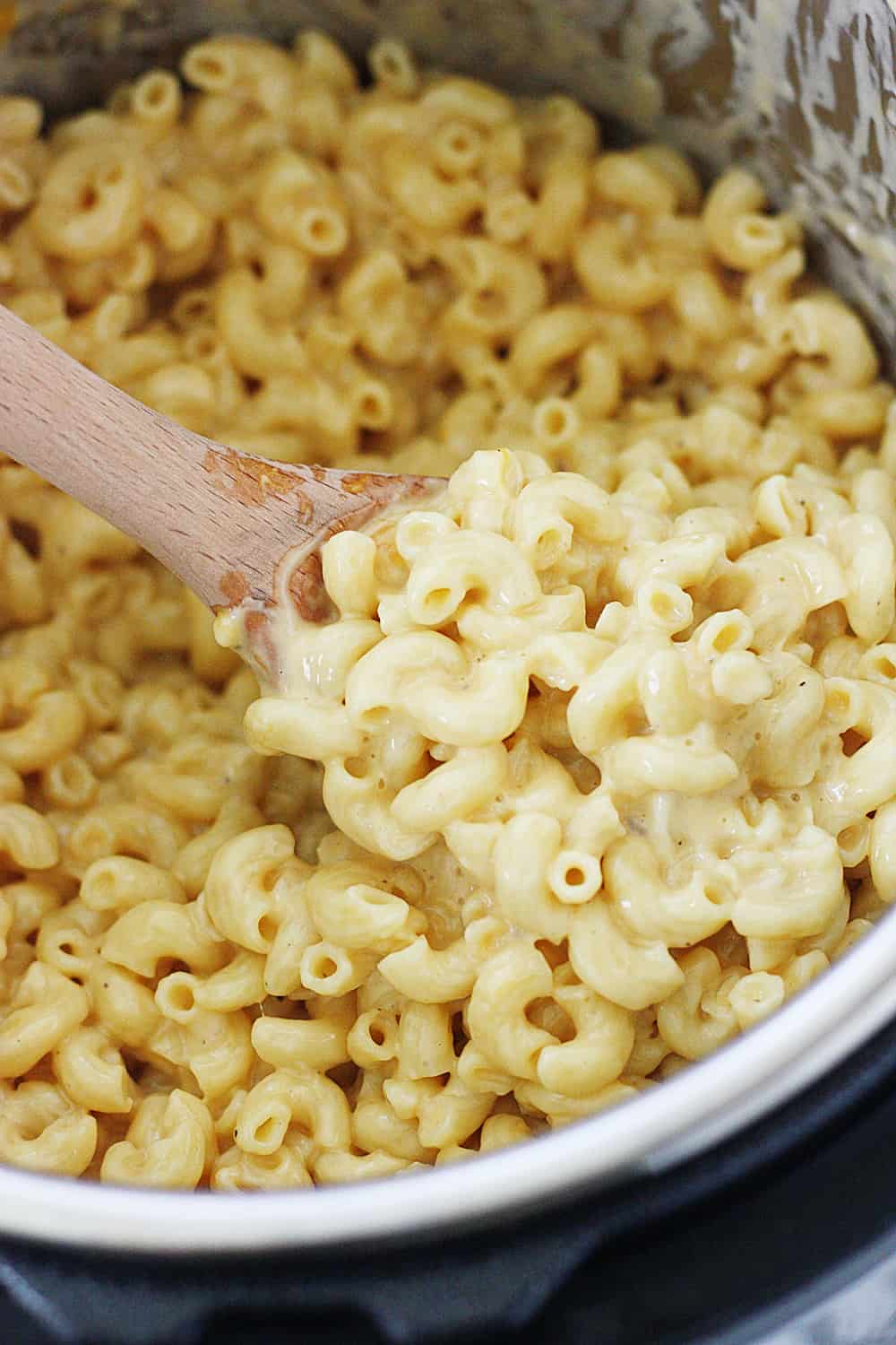 Easy Instant Pot Mac and Cheese - This easy Instant Pot mac and cheese is the creamiest, cheesiest, downright most delicious Instant Pot mac and cheese recipe ever! #macandcheese #instantpot #pressurecooker #macaroniandcheese #pasta #easyrecipe #recipe #cooking #halfscratched #ad #jarlsberg #cheese