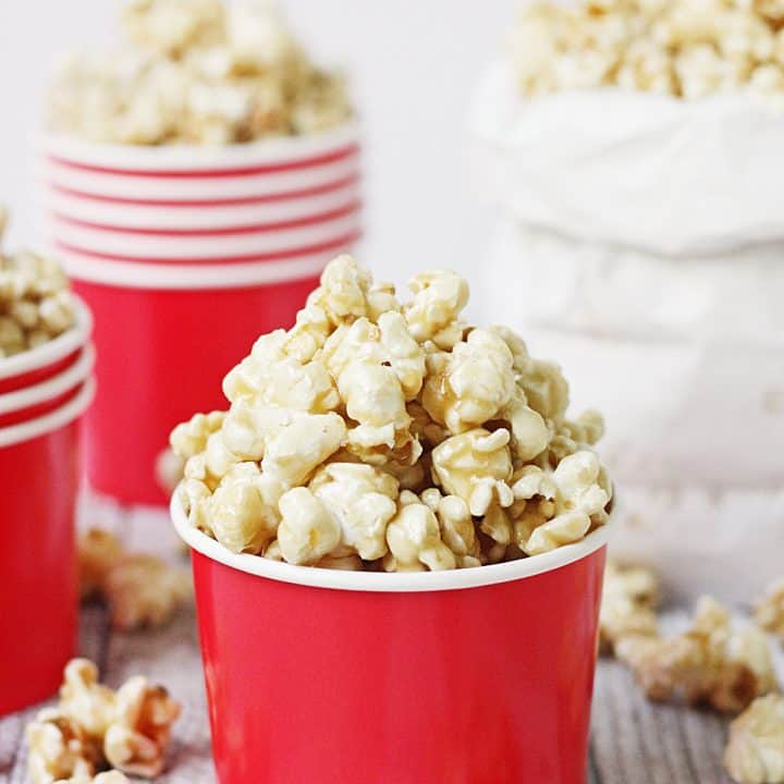 Easy Caramel Popcorn - Who doesn't love a quick, delicious, easy caramel popcorn recipe? The first time you try this easy homemade caramel popcorn, you'll be hooked! #popcorn #caramelpopcorn #halfscratched #caramel #dessert #easyrecipe #sweet