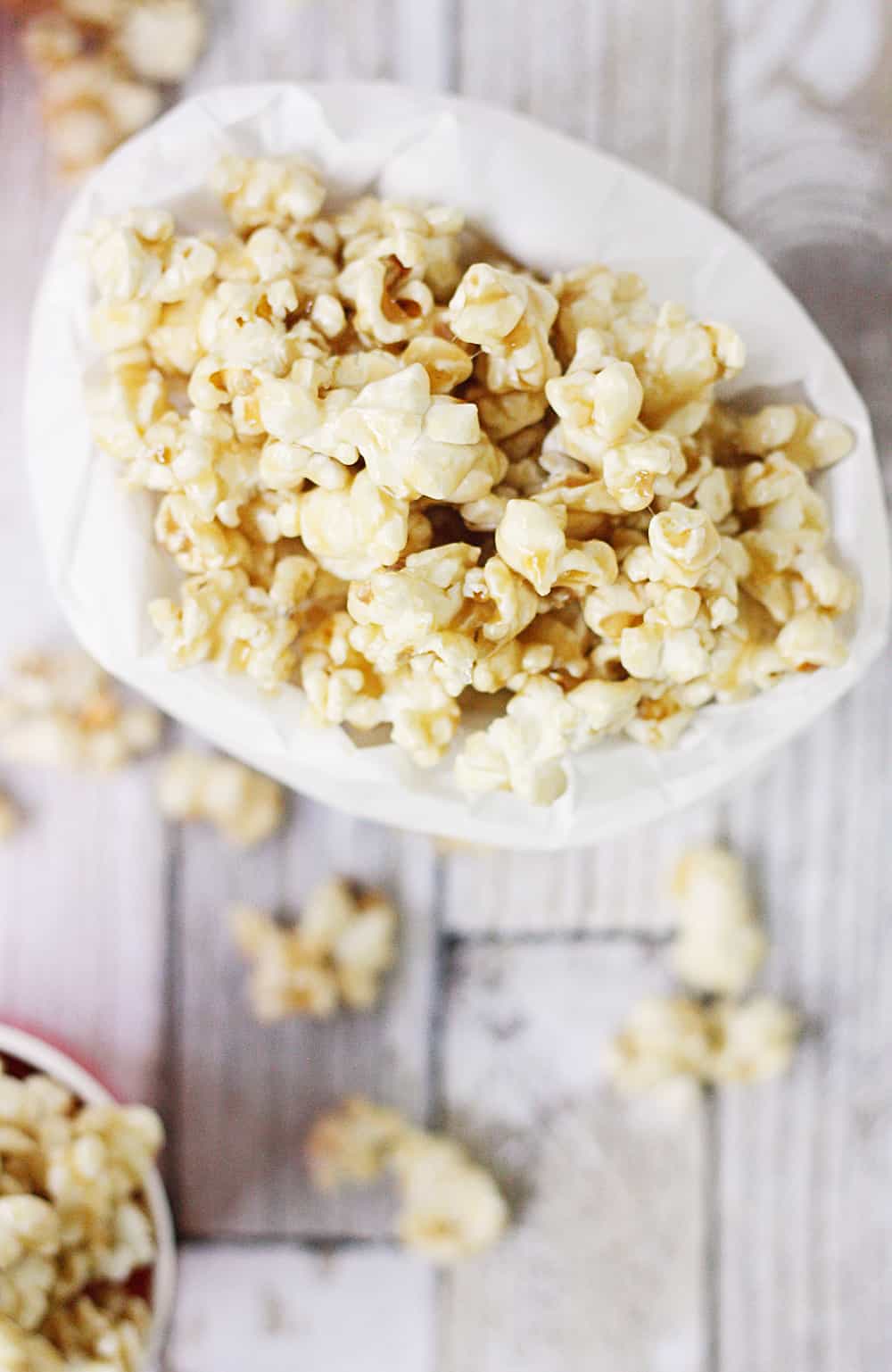 Easy Caramel Popcorn - Who doesn't love a quick, delicious, easy caramel popcorn recipe? The first time you try this easy homemade caramel popcorn, you'll be hooked! #popcorn #caramelpopcorn #halfscratched #caramel #dessert #easyrecipe #sweet