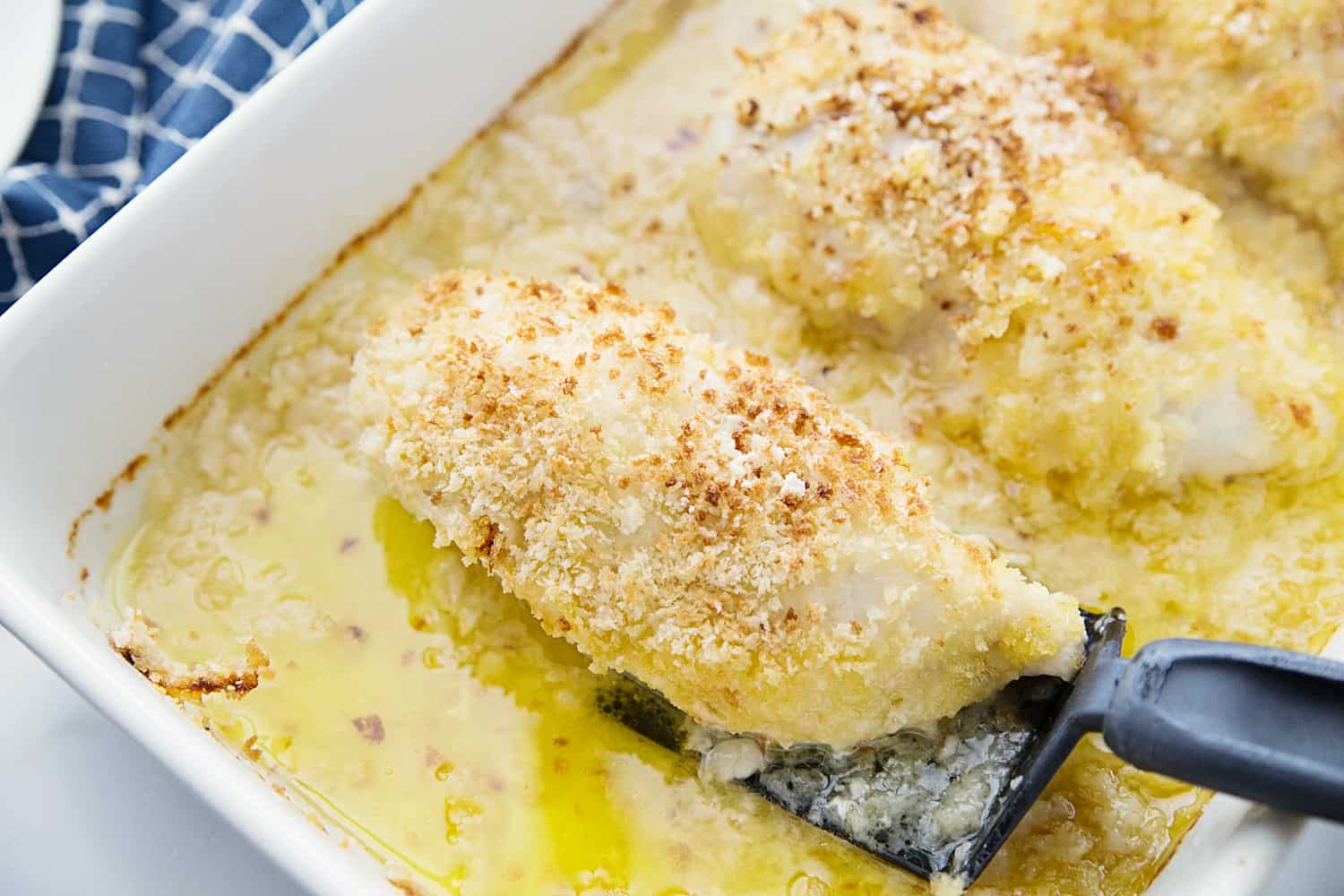 Easy Swiss Cheese Chicken - This Swiss cheese chicken recipe is an easy weeknight meal! Chicken breasts are covered in a creamy sauce and cheese and topped with crispy bread crumbs.