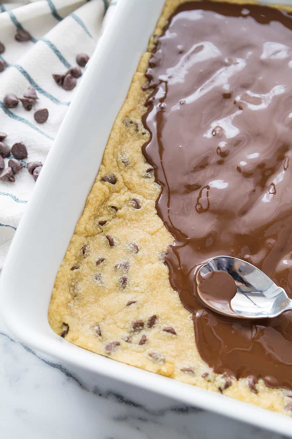 Chocolate Chip Cookie Ice Cream Cake -- Impress guests and taste buds with this chocolate chip cookie ice cream cake. So many layers of scrumptious flavors&Mdash;what's not to love? #icecream #cookie #icecreamcake #dessert #easydessert #dessertrecipe #chocolatechipcookie #halfscratched #baking