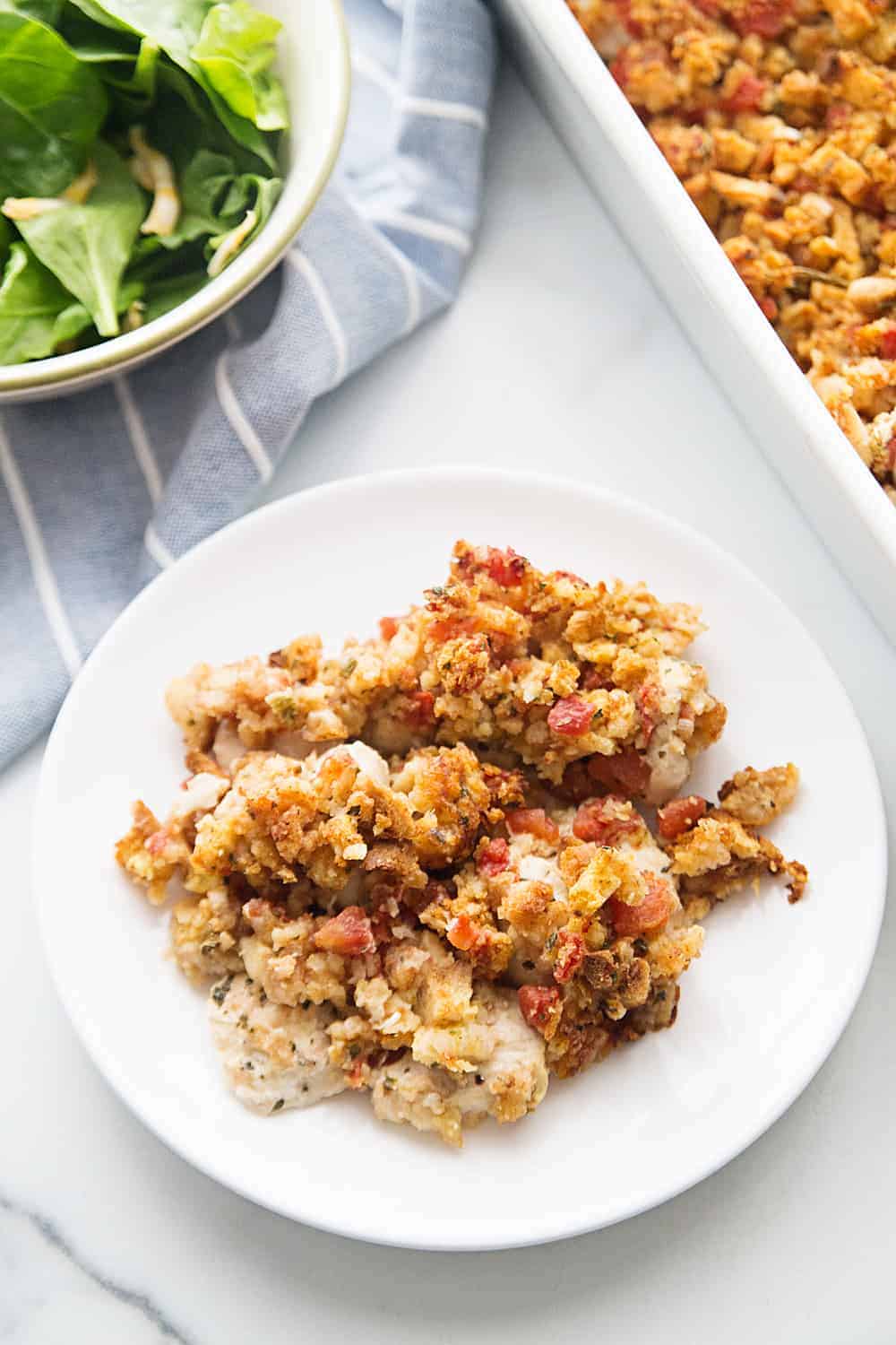 Easy Bruschetta Chicken Bake - Crazy weeknights call for quick dinners like this bruschetta chicken bake. Ready in about 30 minutes, this flavorful dish will become a family favorite! #bruschetta #chicken #chickenrecipe #recipe #halfscratched #easyrecipe #maindish #baking #cooking #bruschettachicken