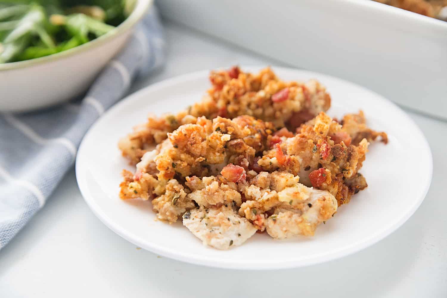 Easy Bruschetta Chicken Bake - Crazy weeknights call for quick dinners like this bruschetta chicken bake. Ready in about 30 minutes, this flavorful dish will become a family favorite! #bruschetta #chicken #chickenrecipe #recipe #halfscratched #easyrecipe #maindish #baking #cooking #bruschettachicken