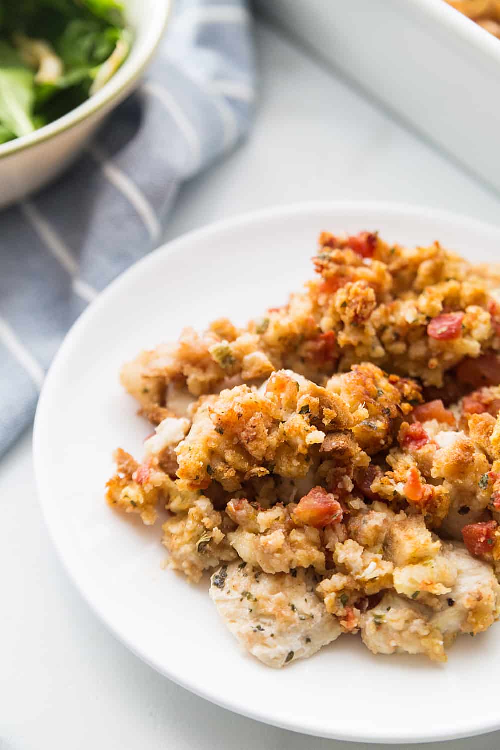 Easy Bruschetta Chicken Bake - Crazy weeknights call for quick dinners like this bruschetta chicken bake. Ready in about 30 minutes, this flavorful dish will become a family favorite! #bruschetta #chicken #chickenrecipe #recipe #halfscratched #easyrecipe #maindish #baking #cooking #bruschettachicken