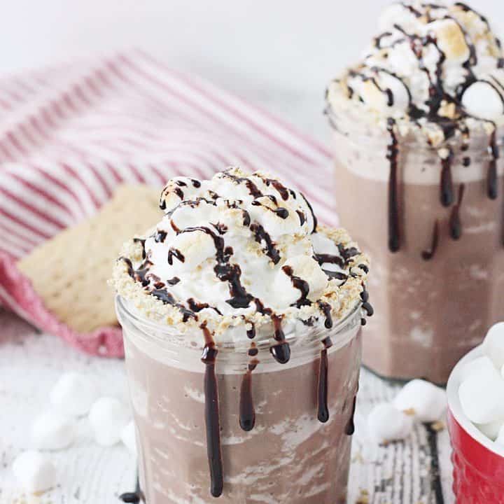 Guilt-Free S'mores Frozen Hot Chocolate - Hot drinks during winter are nice, but sometimes all you want is an icy glass of guilt-free s'mores frozen hot chocolate! #hotchocolate #frozenhotchocolate #torani #aguiltfreeholiday #ad #halfscratched #smores #dessert #drinkrecipe #holidayrecipe