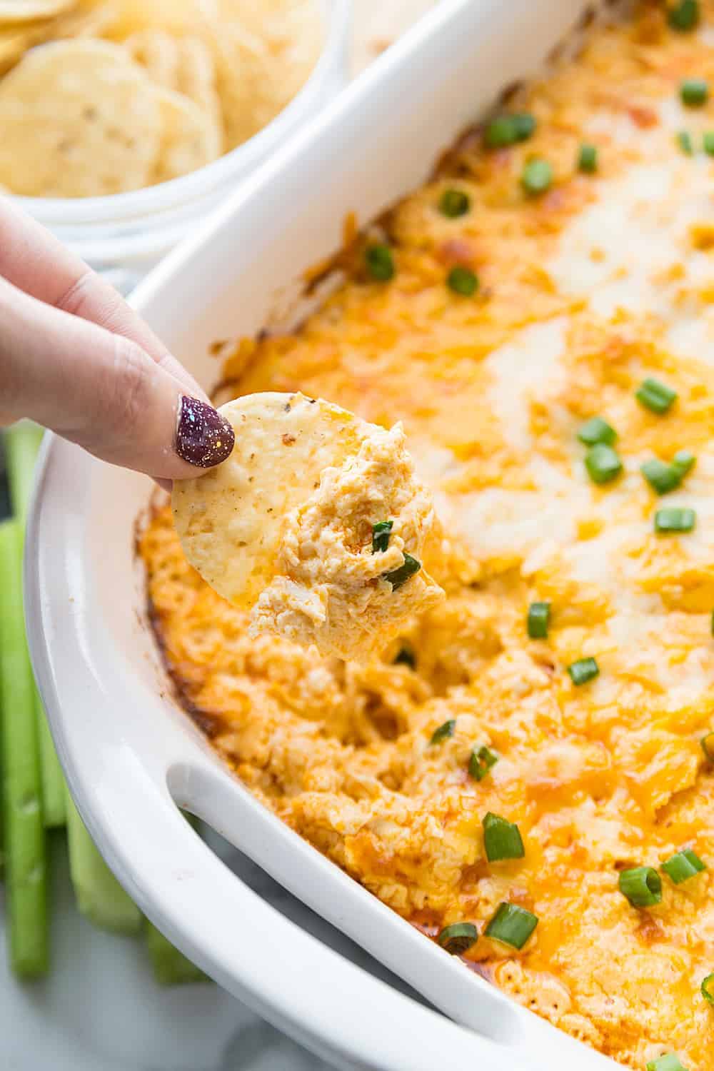 Best Buffalo Chicken Dip a nacho being dipped.