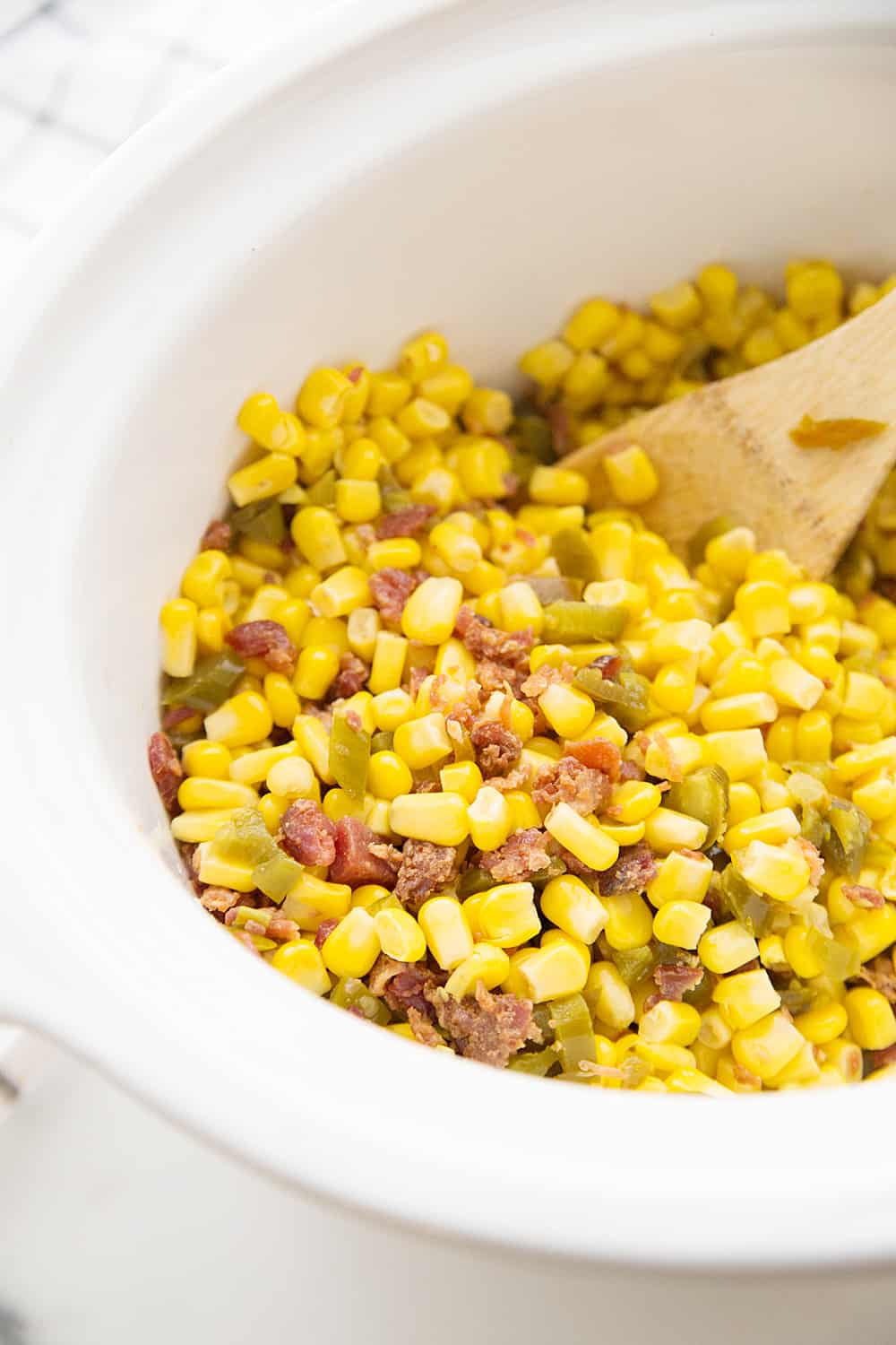 Slow Cooker Cheesy Hot Corn Dip - Looking for a game day appetizer that will have family, friends, and fans cheering? Serve a slow cooker full of this cheesy hot corn dip! #appetizer #slowcooker #crockpot #recipe #corndip #hotcorndip #halfscratched #slowcookerrecipe #crockpotrecipe #appetizerrecipe