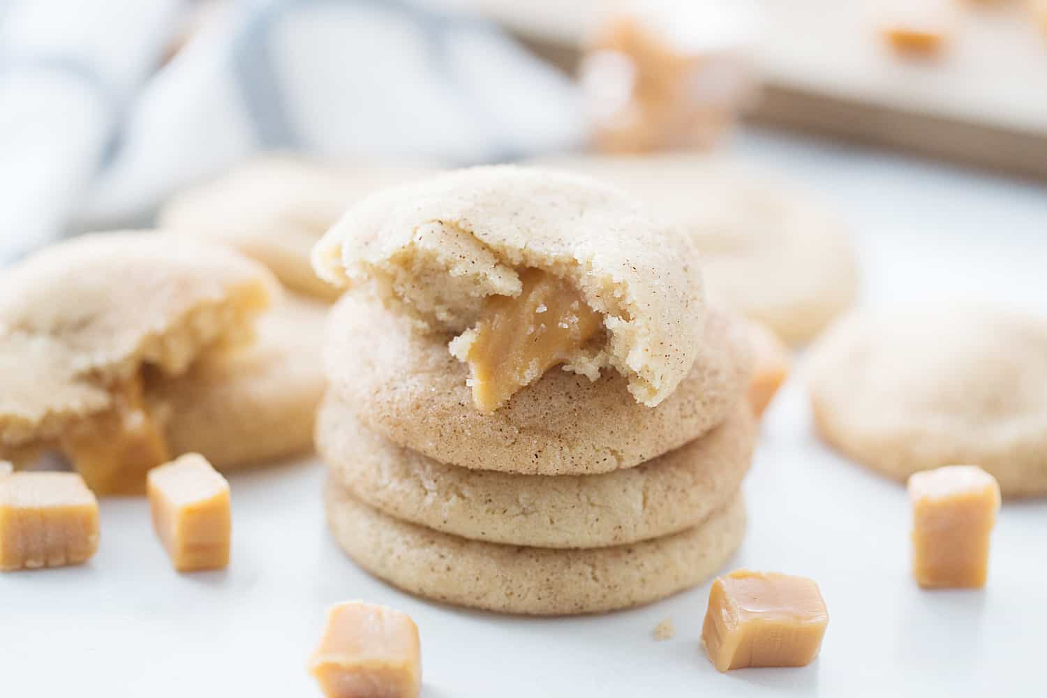 Caramel Snickerdoodles - Caramel snickerdoodles may change the way you bake snickerdoodles forever. These cinnamon sugar cookies are soft, chewy, and all kinds of gooey. #cookies #snickerdoodles #baking #halfscratched #caramel #cookierecipe #dessert #sweet