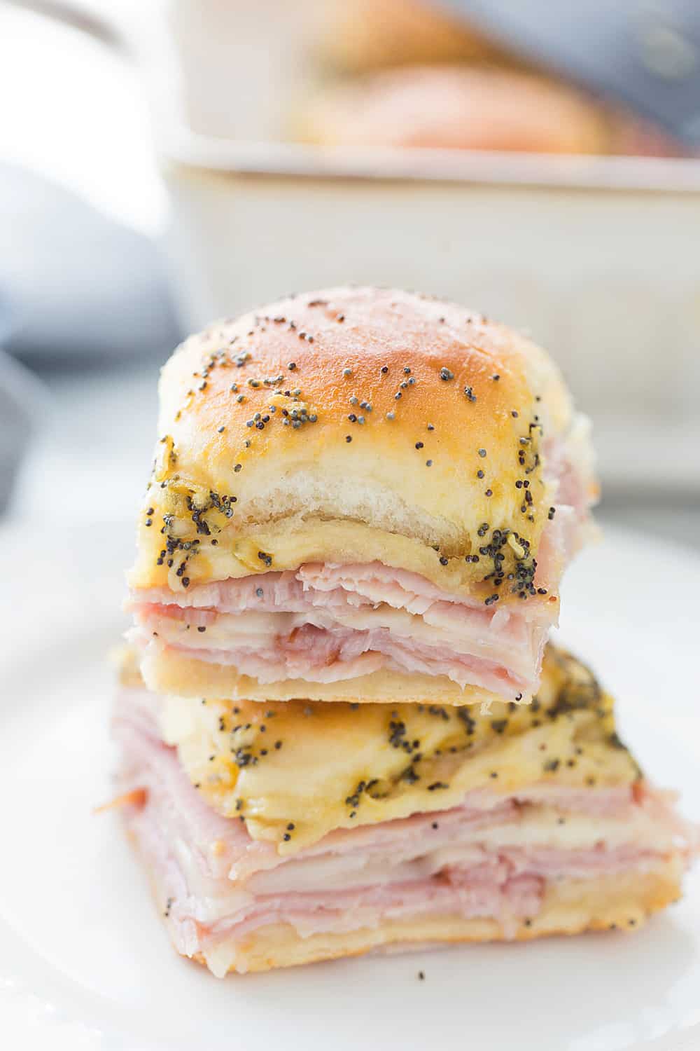 Hawaiian Ham & Cheese Sliders - Need a tasty way to use leftover ham or a recipe that'll feed a crowd? Look no further than Hawaiian ham and cheese sliders! #sliders #leftoverham #easyrecipe #hamandcheesesliders #maindish #baking #partyrecipe #holidayrecipe #halfscratched