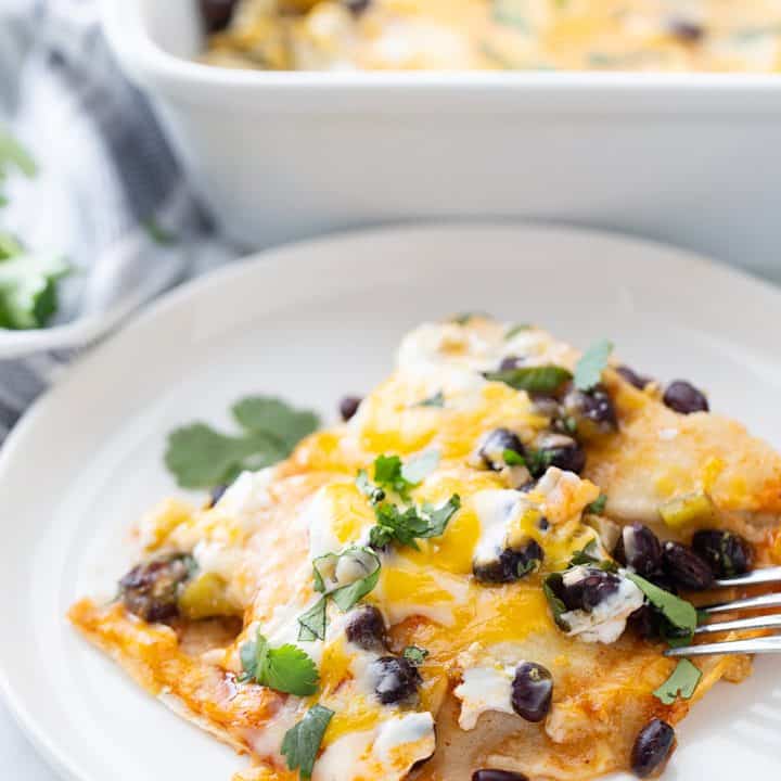 Layered Black Bean Enchiladas - When you don't have the time for classic chicken enchiladas, try these layered black bean enchilads. Quick, easy, and delicious! #enchiladas #mexicanrecipe #mexicanfood #blackbean #halfscratched #tacotuesday #easyrecipe #enchilada