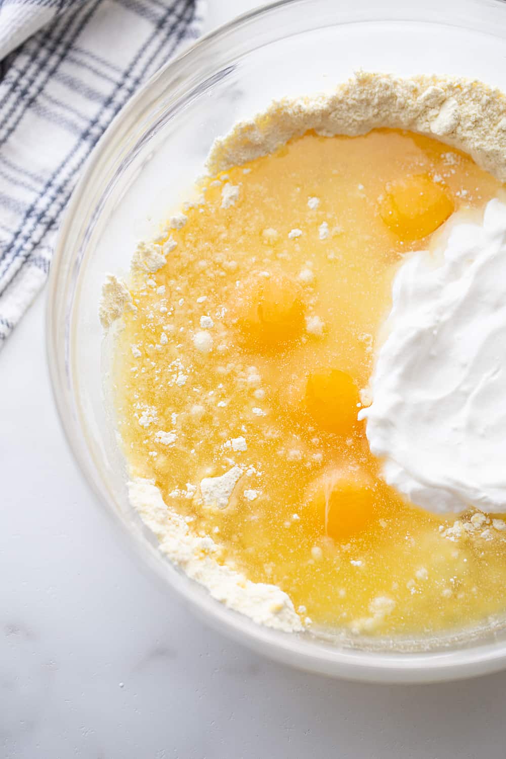 Honey Bun Cake ingredients in a glass bowl.