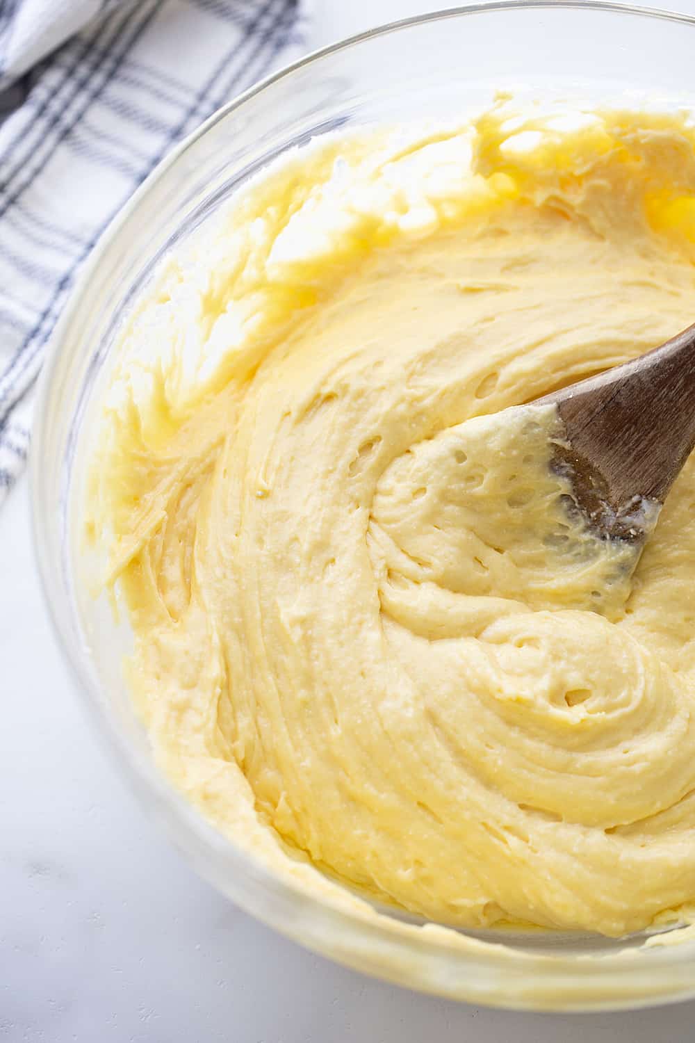 mixing ingredients in a glass bowl.