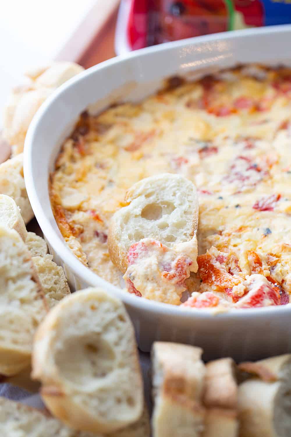 Hot Roasted Red Pepper Dip - Planning a summer staycation? #ad Make sure to add some hot roasted red pepper dip to the schedule. In fact, it's so good, you'll want to list it twice! The rich, smoky flavor of @Mezzetta roasted red peppers take this creamy, cheesy, flavorful dip to an entirely new level—a totally tasty, gotta-have-it level! #Mezzetta #halfscratched #hotdip #hotappetizer #appetizer #baking #cooking #vegetarian