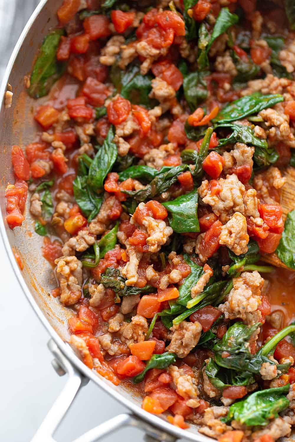 Tomato and Spinach Pasta Toss - With this easy tomato and spinach pasta toss recipe in your rotation, you can have a delicious, hearty meal ready in minutes! #pasta #italianfood #halfscratched #tomato #spinach #pastarecpie #maindish