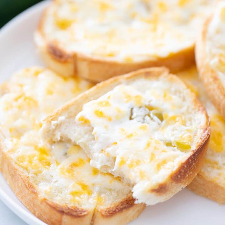 Creamy, cheesy spread with a bit of kick? Check! This zesty cheese spread is a must-have appetizer whether you're having a party of 1 or 100. | #halfscratched #appetizer #cheese #easyrecipe #hotappetizer #baking #cheesespread #easyappetizer