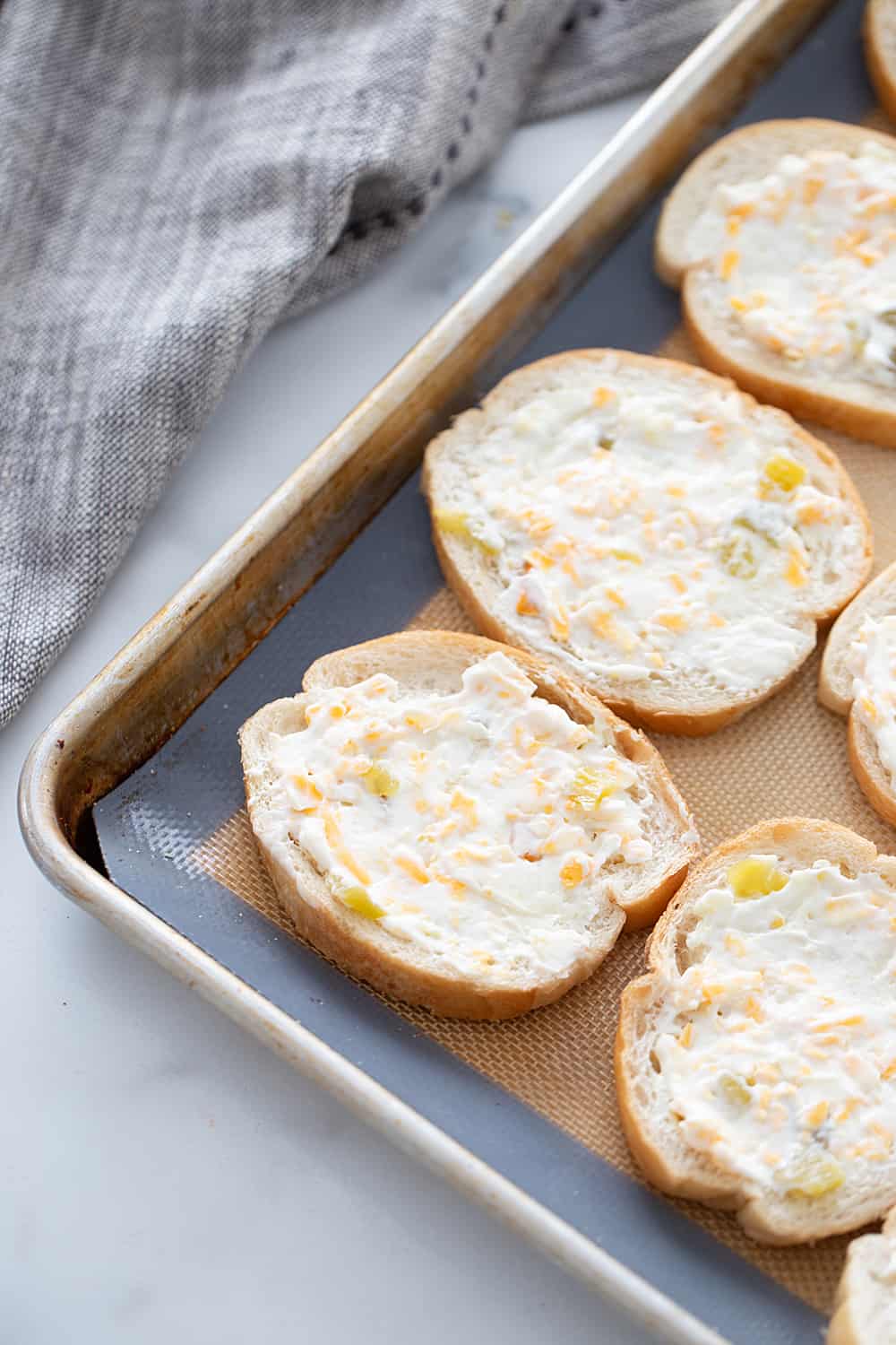 Creamy, cheesy spread with a bit of kick? Check! This zesty cheese spread is a must-have appetizer whether you're having a party of 1 or 100. | #halfscratched #appetizer #cheese #easyrecipe #hotappetizer #baking #cheesespread #easyappetizer