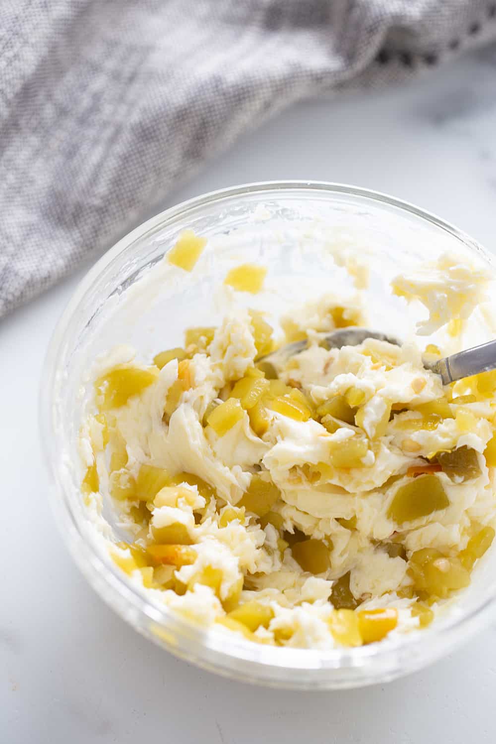 Creamy, cheesy spread with a bit of kick? Check! This zesty cheese spread is a must-have appetizer whether you're having a party of 1 or 100. | #halfscratched #appetizer #cheese #easyrecipe #hotappetizer #baking #cheesespread #easyappetizer