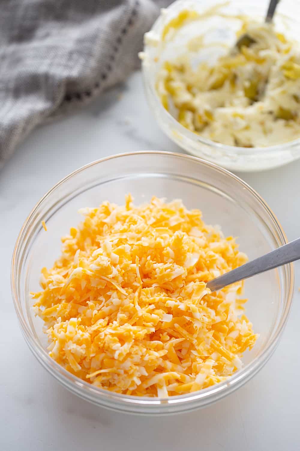 Creamy, cheesy spread with a bit of kick? Check! This zesty cheese spread is a must-have appetizer whether you're having a party of 1 or 100. | #halfscratched #appetizer #cheese #easyrecipe #hotappetizer #baking #cheesespread #easyappetizer