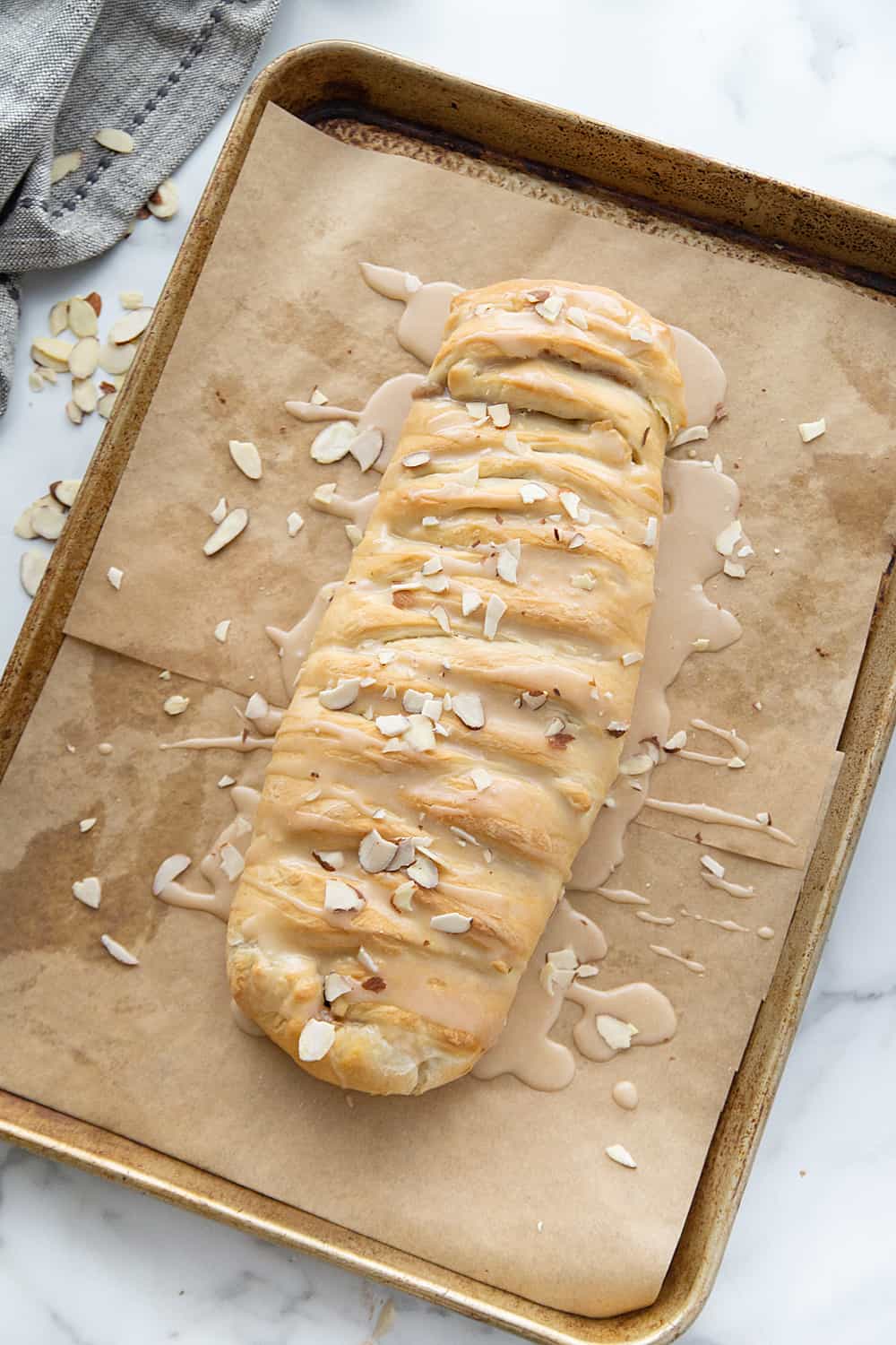 Easy Almond Braid - This easy almond braid is simple *and* totally scrumptious. Good luck not eating the entire beautifully braided dessert in one sitting! #halfscratched #dessert #brunch #almond #almonddessert #baking #almondbraid #braideddessert #recipe #dessertrecipe