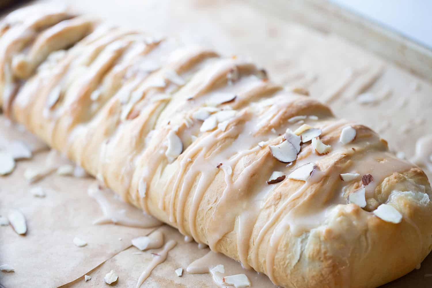Easy Almond Braid - This easy almond braid is simple *and* totally scrumptious. Good luck not eating the entire beautifully braided dessert in one sitting! #halfscratched #dessert #brunch #almond #almonddessert #baking #almondbraid #braideddessert #recipe #dessertrecipe