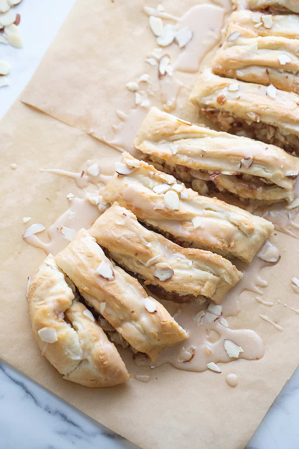 Easy Almond Braid - This easy almond braid is simple *and* totally scrumptious. Good luck not eating the entire beautifully braided dessert in one sitting! #halfscratched #dessert #brunch #almond #almonddessert #baking #almondbraid #braideddessert #recipe #dessertrecipe