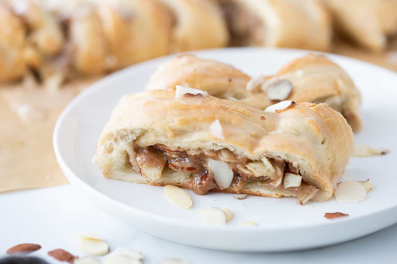 Easy Almond Braid - This easy almond braid is simple *and* totally scrumptious. Good luck not eating the entire beautifully braided dessert in one sitting! #halfscratched #dessert #brunch #almond #almonddessert #baking #almondbraid #braideddessert #recipe #dessertrecipe