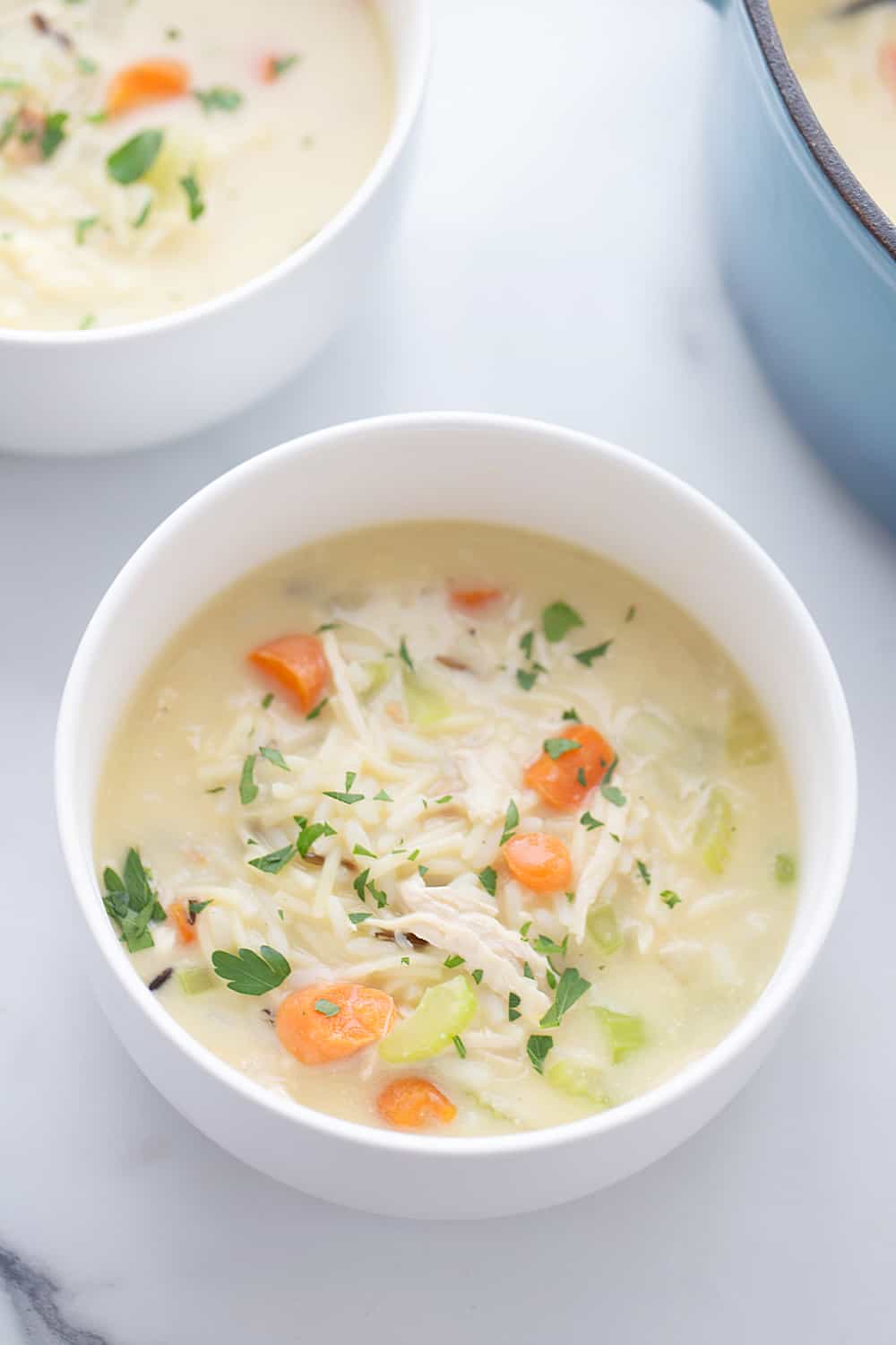 Easy Creamy Chicken Noodle and Rice Soup - Need a comforting weeknight meal that's also quick and easy? Give this creamy chicken noodle and rice soup a try! #soup #chickensoup #chickennoodlesoup #easyrecipe #halfscratched #maindish #easysoup #souprecipe