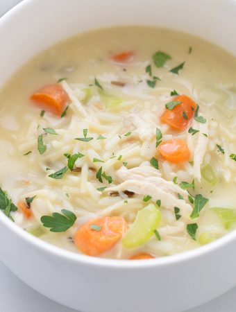 Easy Creamy Chicken Noodle and Rice Soup - Need a comforting weeknight meal that's also quick and easy? Give this creamy chicken noodle and rice soup a try! #soup #chickensoup #chickennoodlesoup #easyrecipe #halfscratched #maindish #easysoup #souprecipe