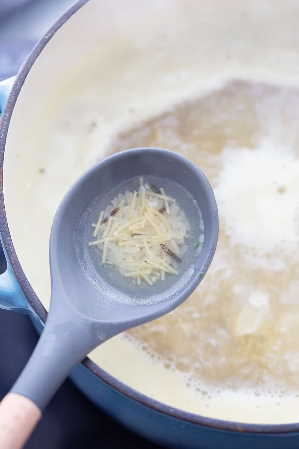 Easy Creamy Chicken Noodle and Rice Soup - Need a comforting weeknight meal that's also quick and easy? Give this creamy chicken noodle and rice soup a try! #soup #chickensoup #chickennoodlesoup #easyrecipe #halfscratched #maindish #easysoup #souprecipe