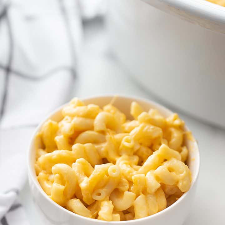 Easy Slow Cooker Mac and Cheese - Even the pickiest eaters will love easy slow cooker mac and cheese: a combo of sharp cheddar and Colby Jack plus a few surprise ingredients. #macandcheese #easyrecipe #halfscratched #slowcooker #pasta