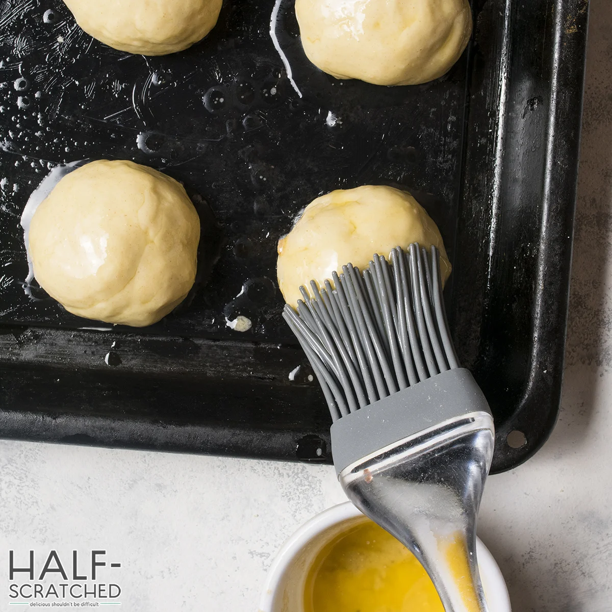 Covering biscuit with butter on top