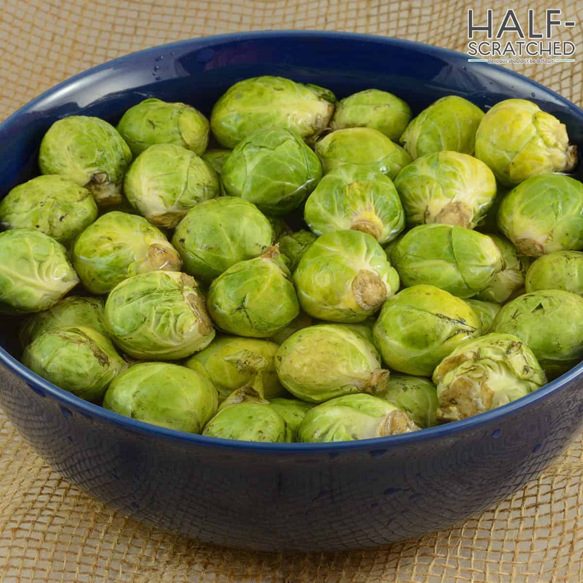 Brussels sprouts soaking in water bowl