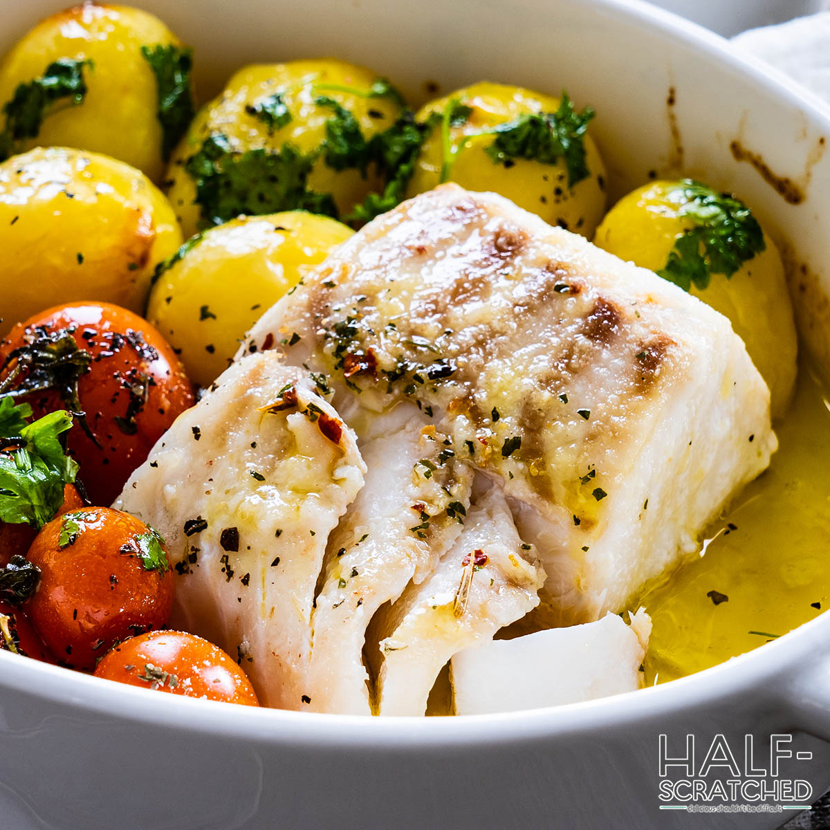 Cod in oven with tomatoes and potatoes