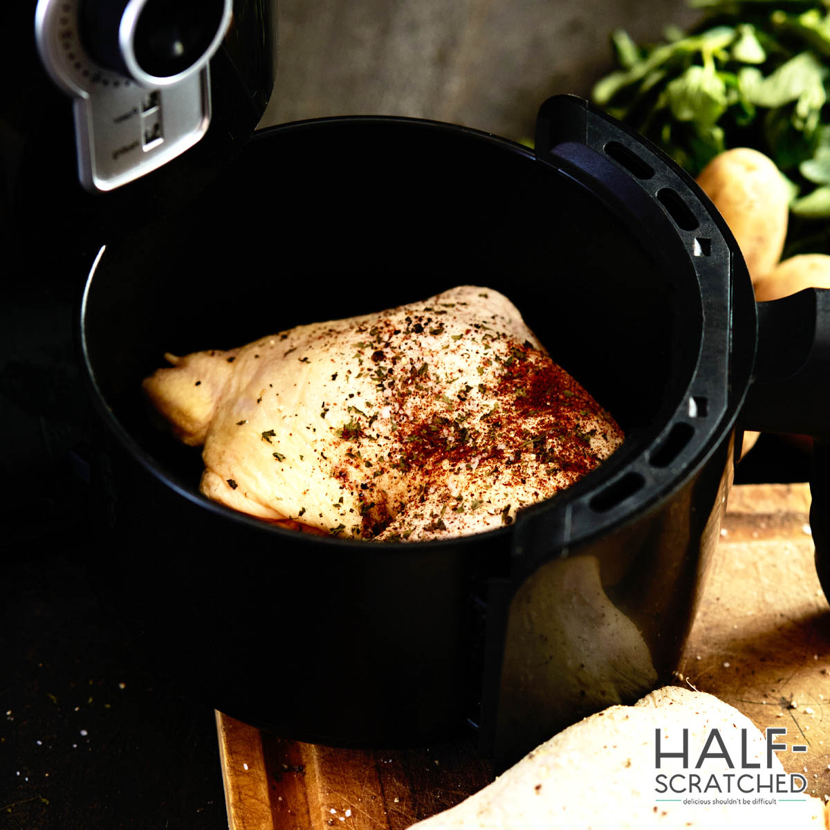 Seasoned chicken thigh in an air fryer