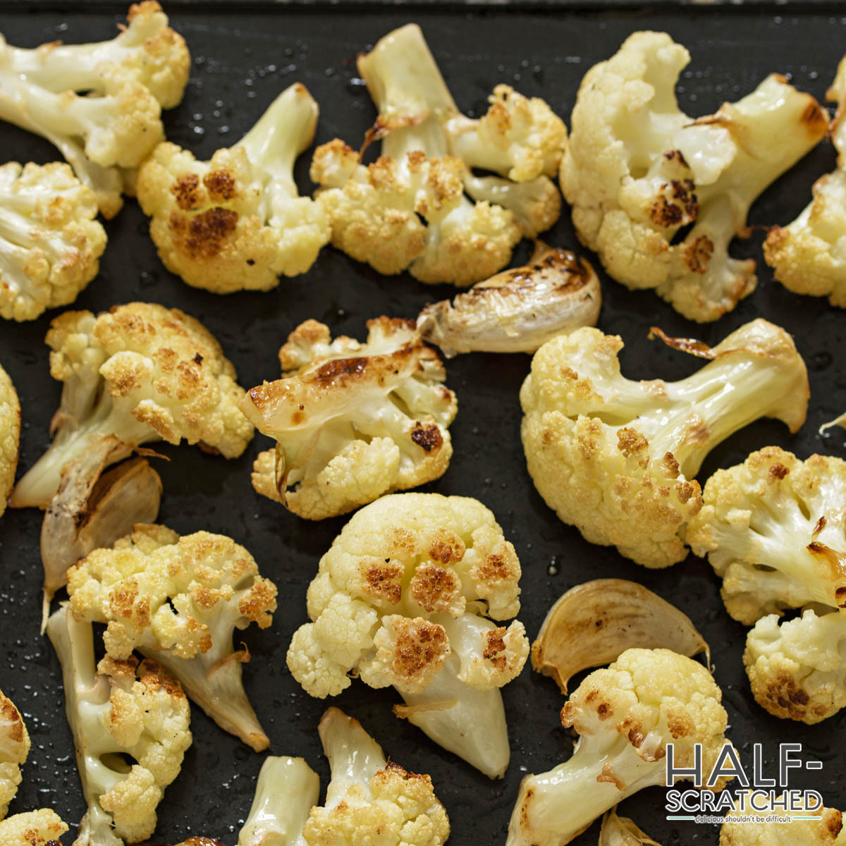 Roasted cauliflower florets in the oven at 400 F