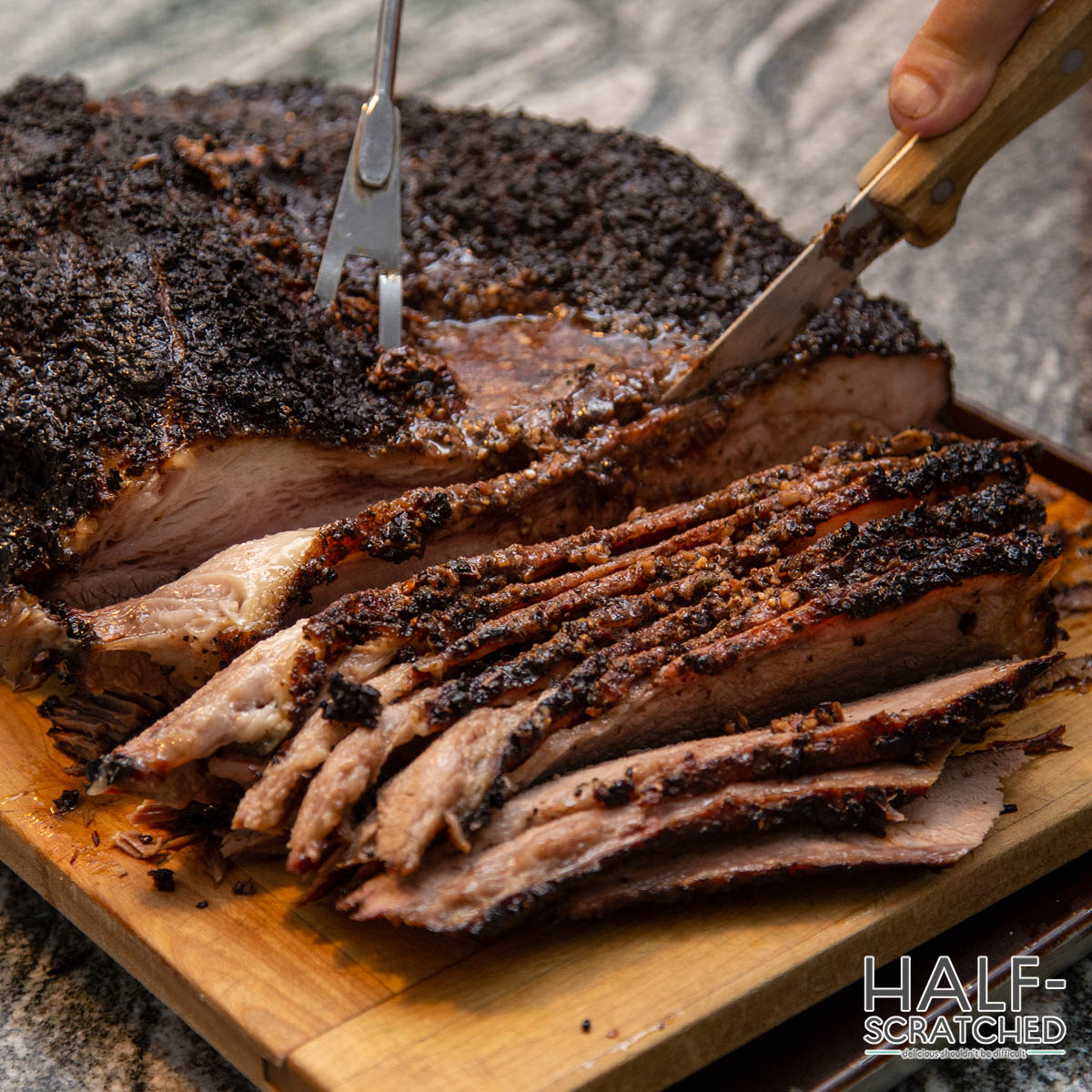 Slicing a slow cooked smoked brisket