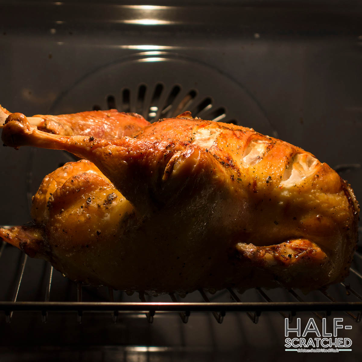 Whole chicken roasting in the oven at 400F