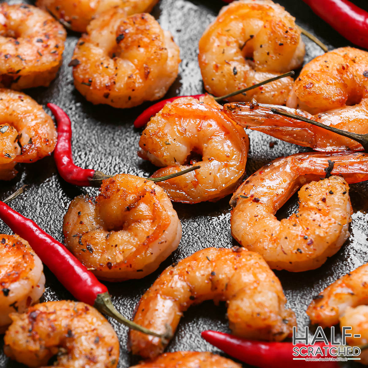 Shrimp tails curled in C shape on an baking tray