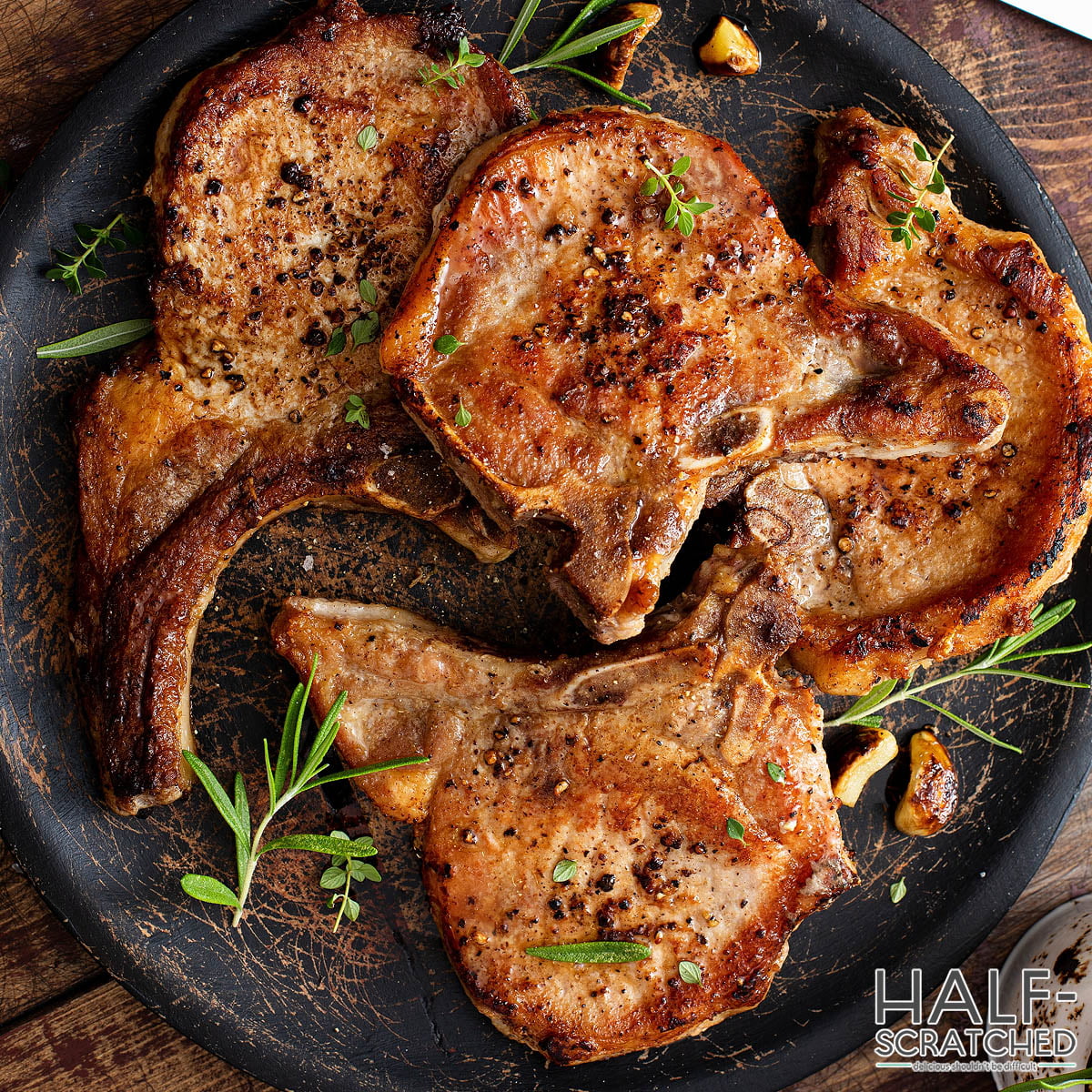 broiled pork chops on a plate