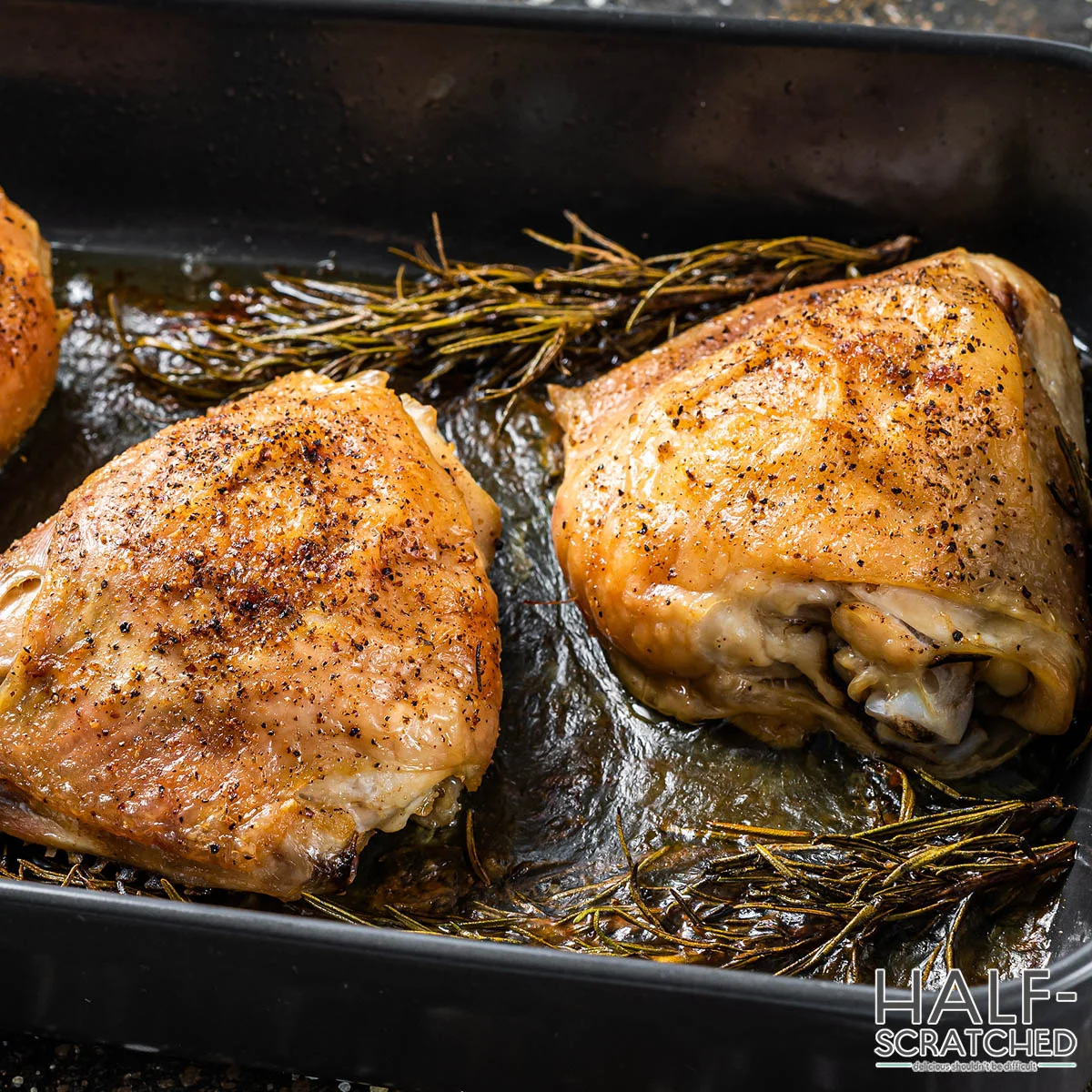 Oven broiled chicken thighs in an oven tray