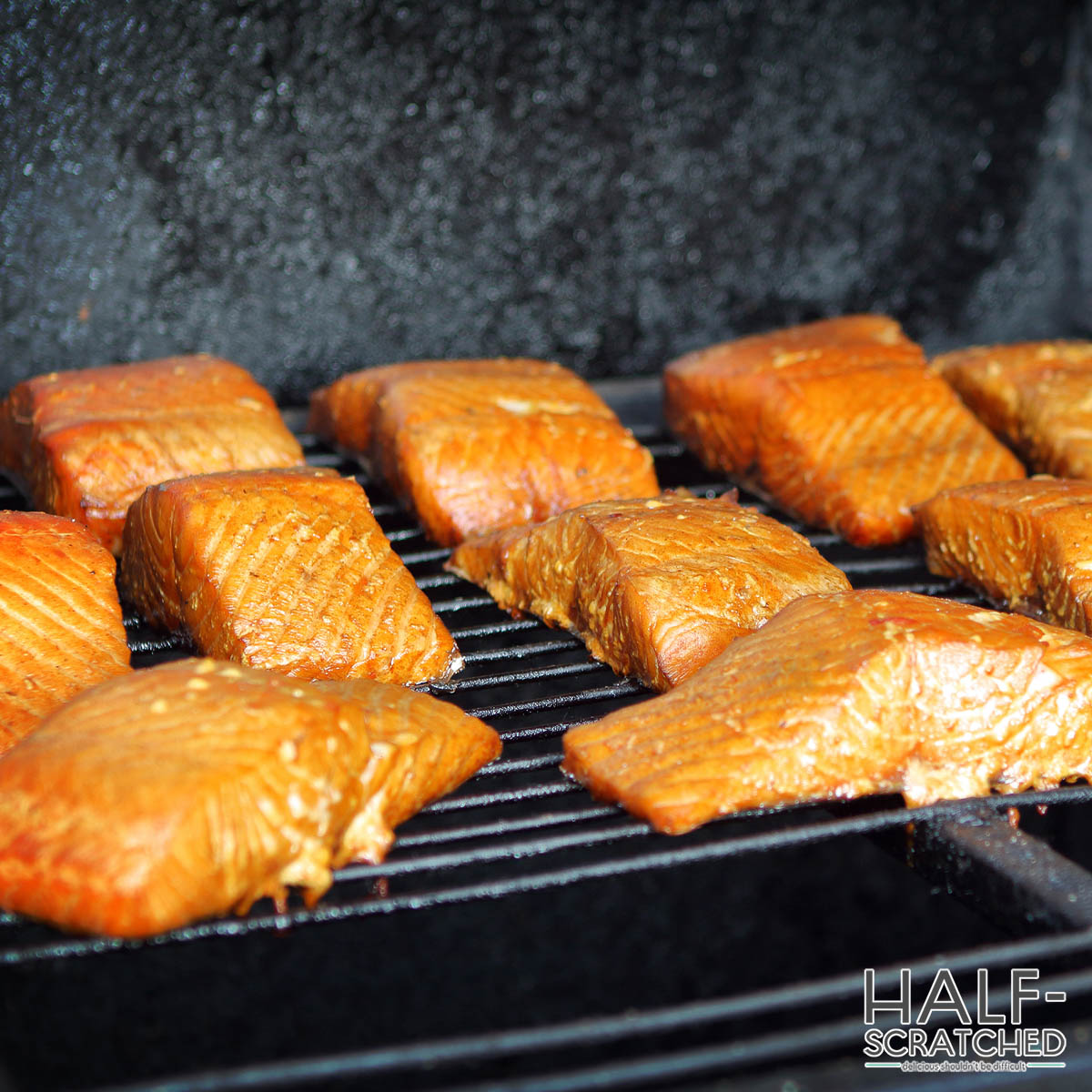 Salmon fillets in a smoker