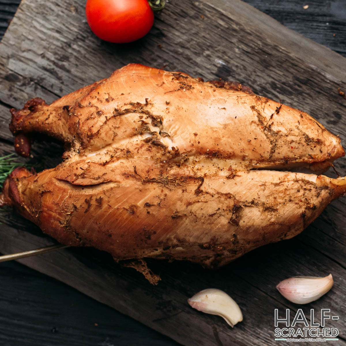 Smoked chicken on a wooden board
